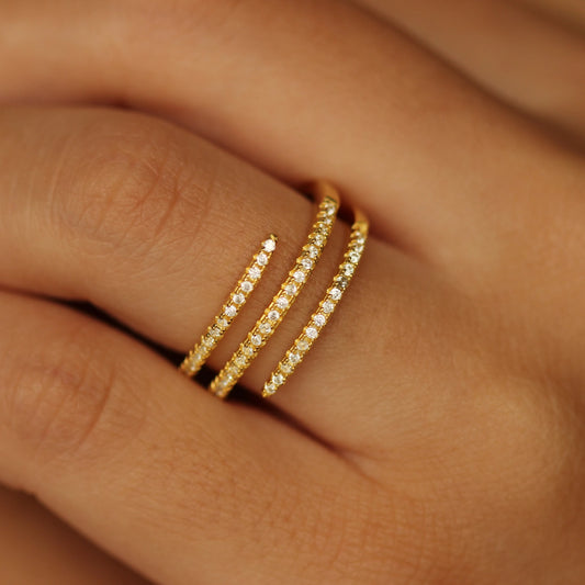 Gold spiral ring on hand