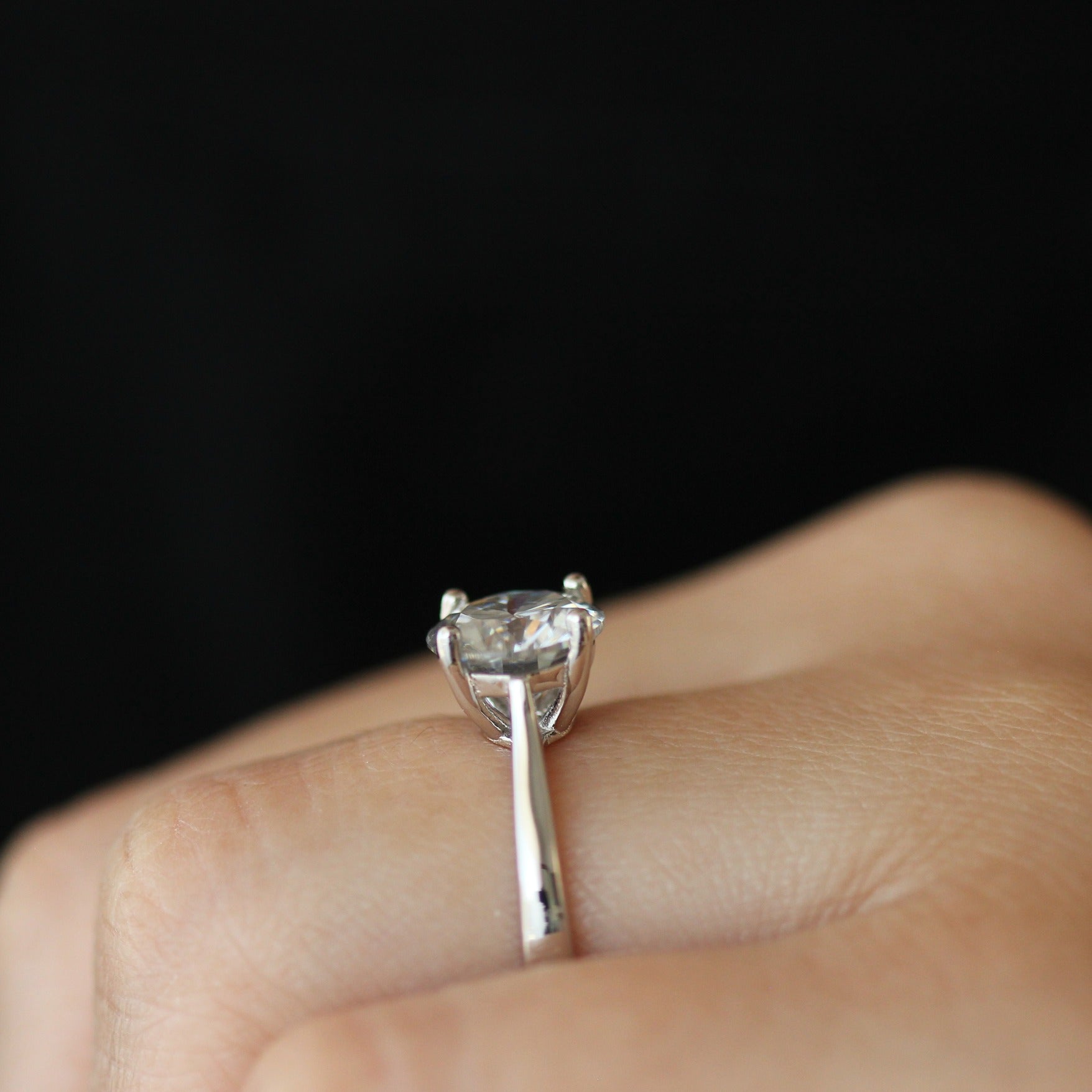 2ct round moissanite ring side view on hand