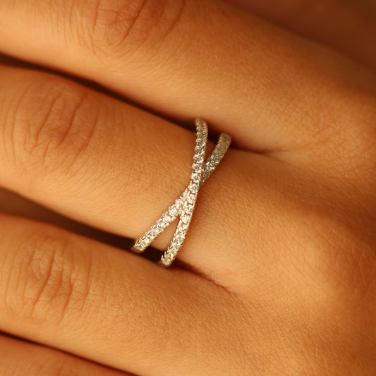 Criss cross statement ring on hand
