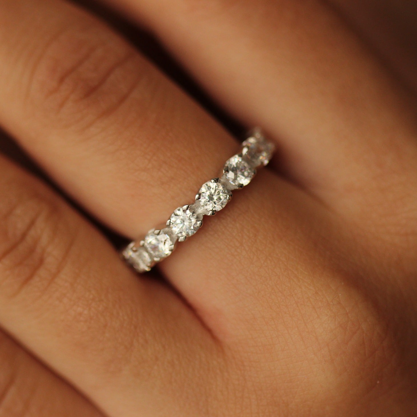 3.5mm round cut silver eternity ring on hand