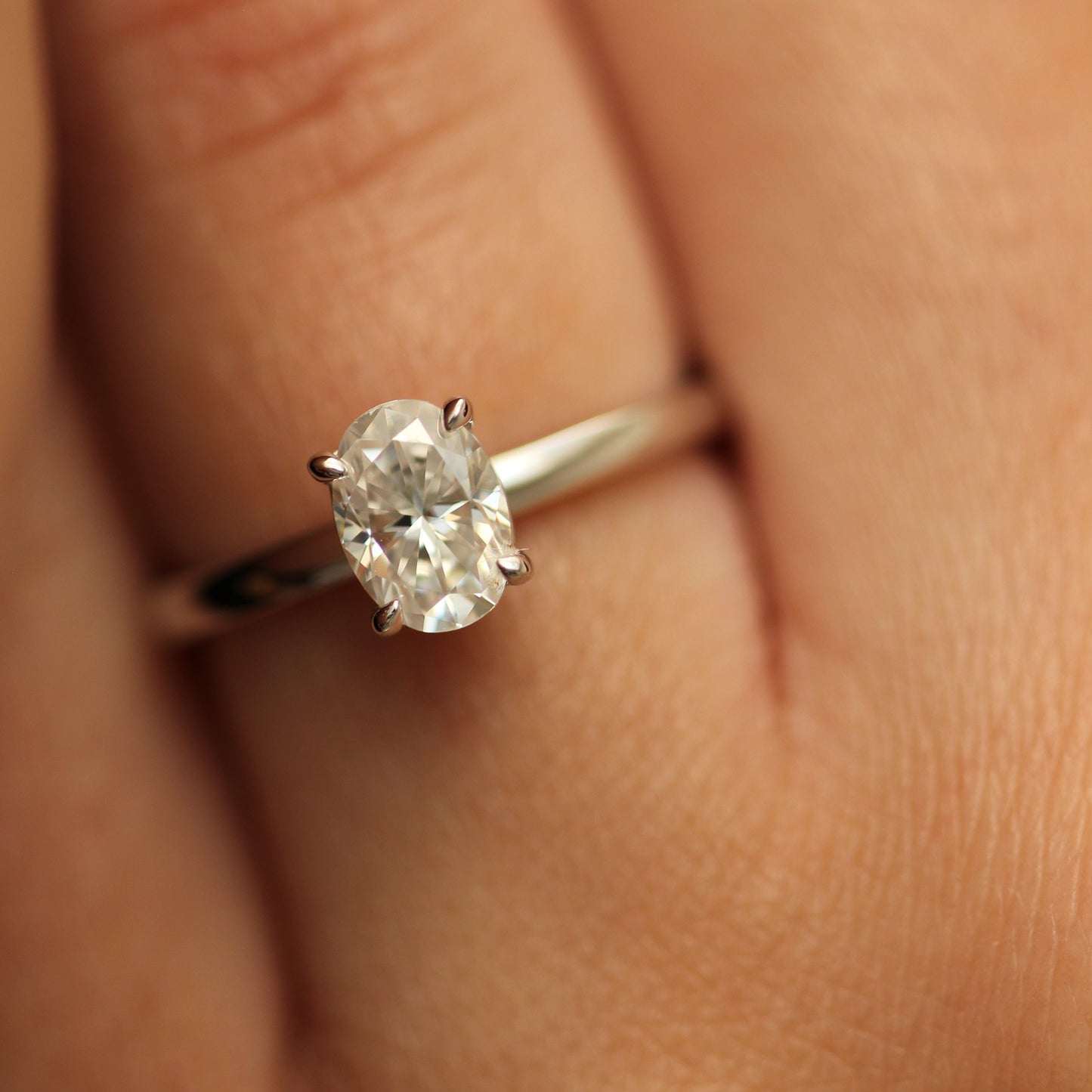 1ct oval moissanite ring on hand
