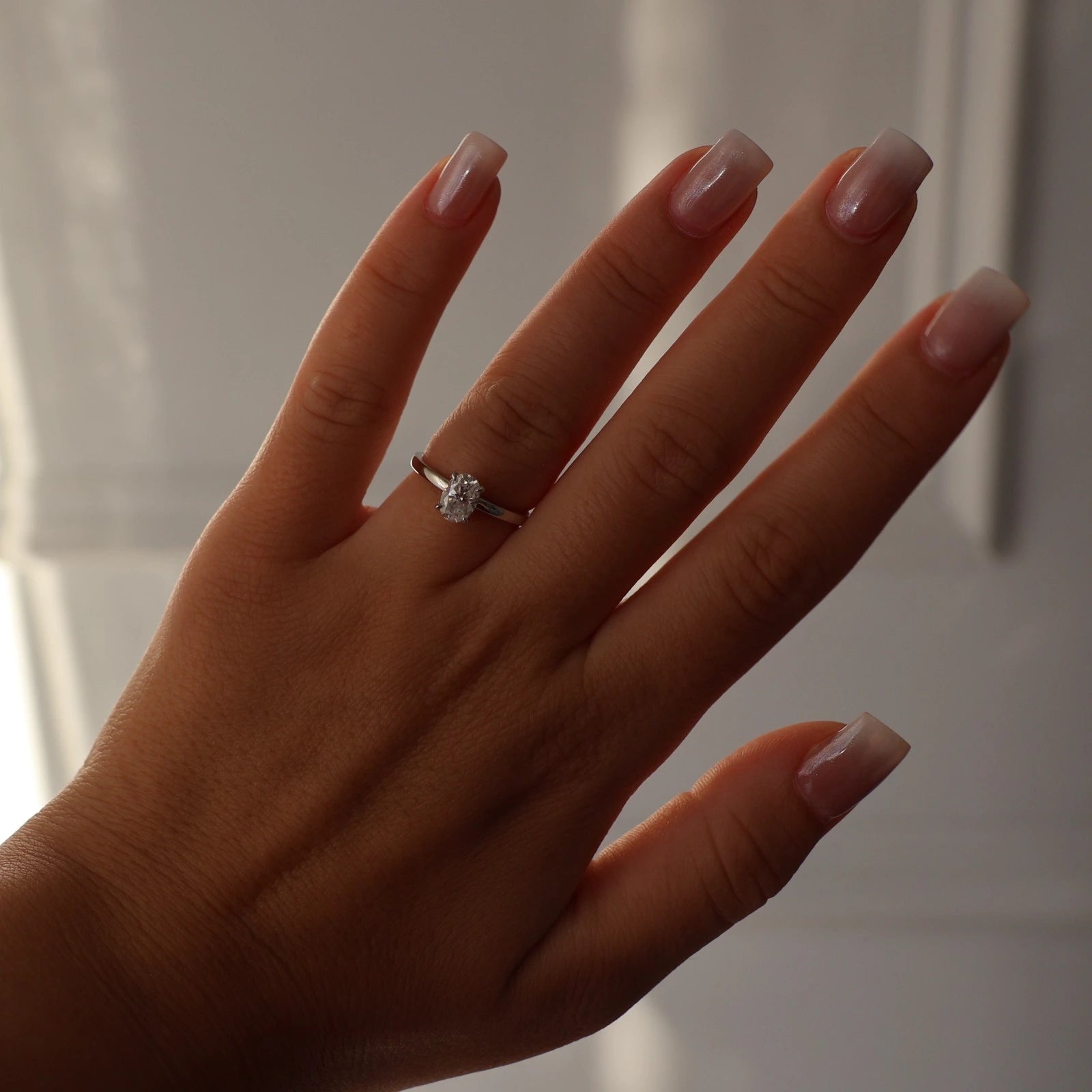 1ct oval moissanite ring on hand