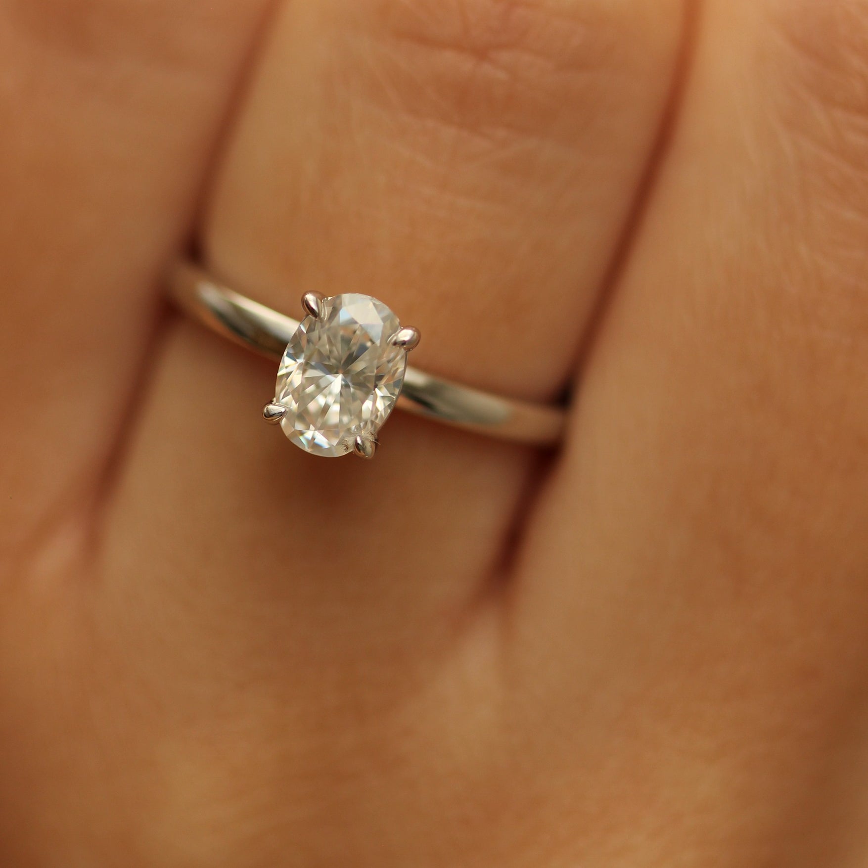 1ct oval moissanite ring on hand