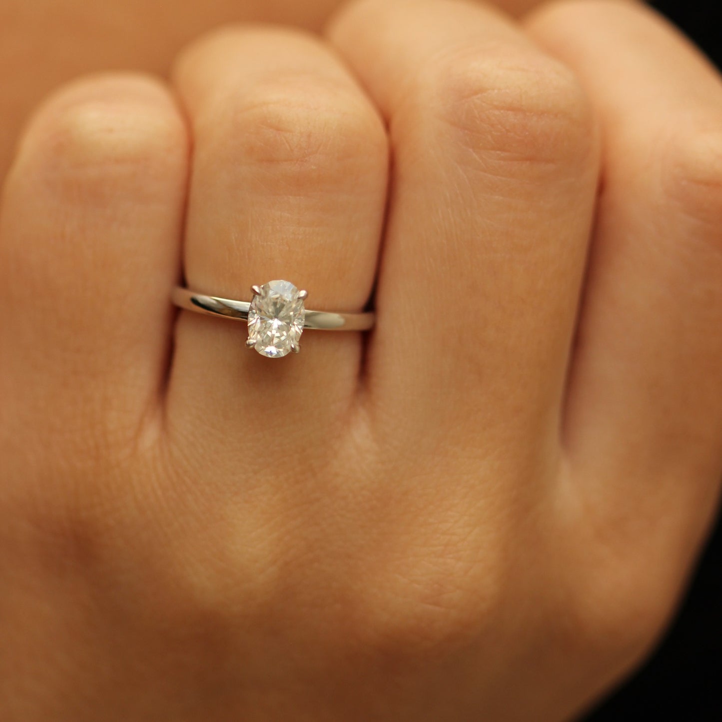1ct oval moissanite ring on hand