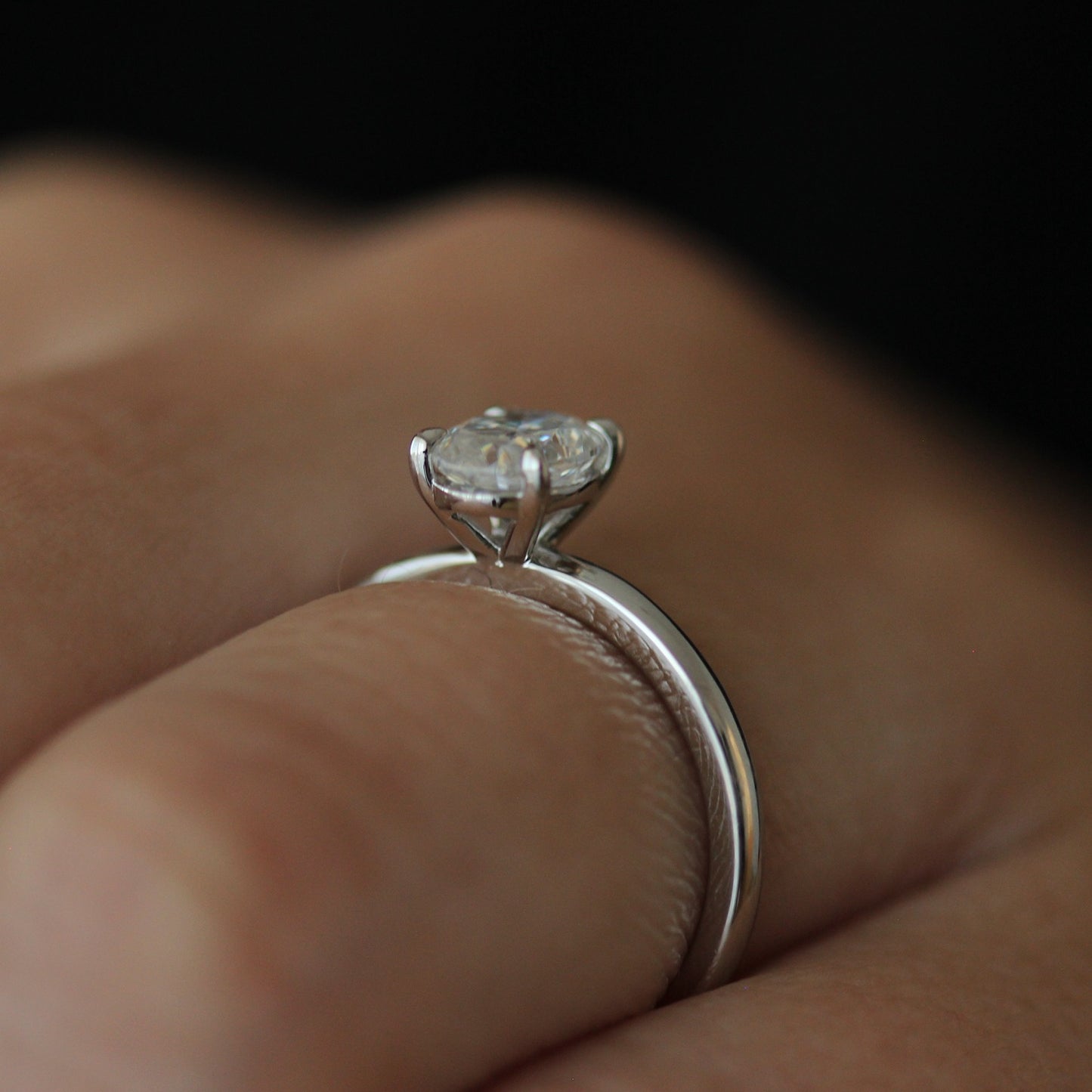 Side view of 1ct oval moissanite ring