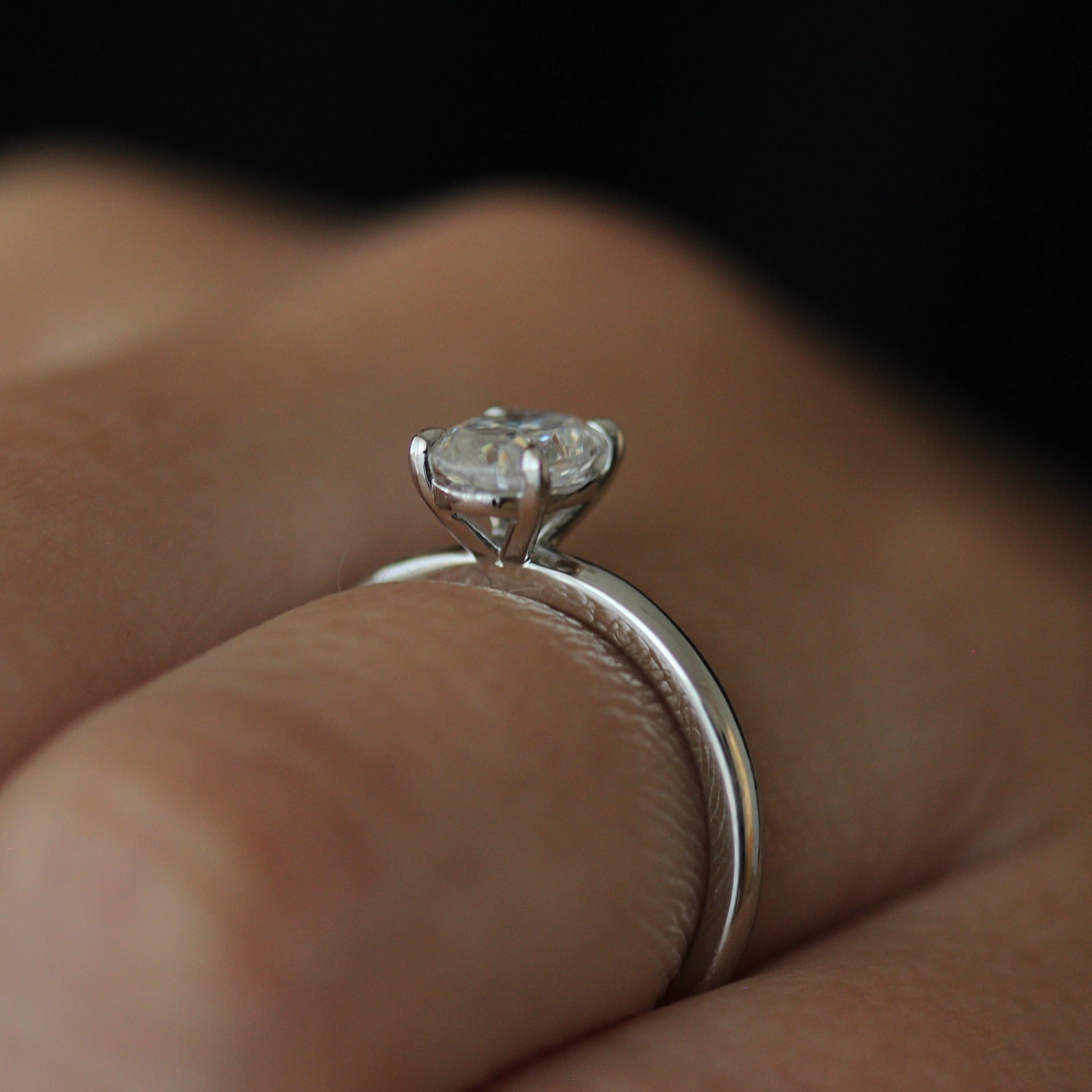 Side view of 1ct oval moissanite ring