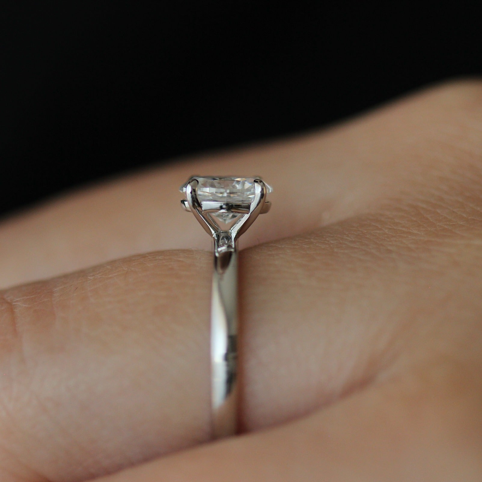 Side view of 1ct oval moissanite ring