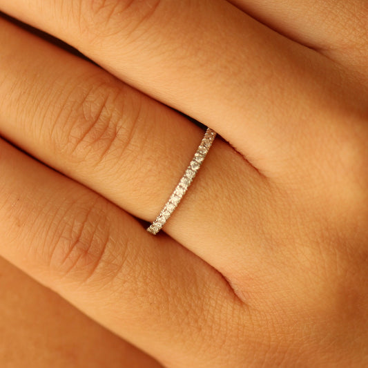 Half eternity pave ring on hand