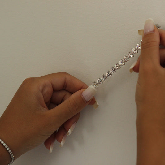Heart tennis bracelet held in hands