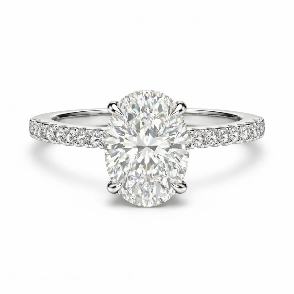 oval moissanite ring with pave band and hidden halo on white background