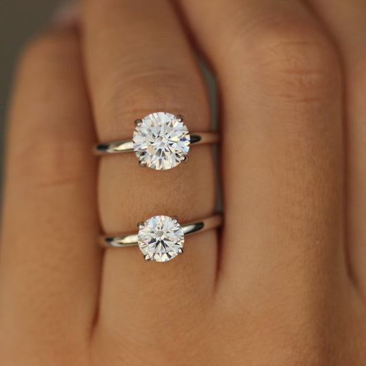 1ct Round ring and 2ct round ring on hand