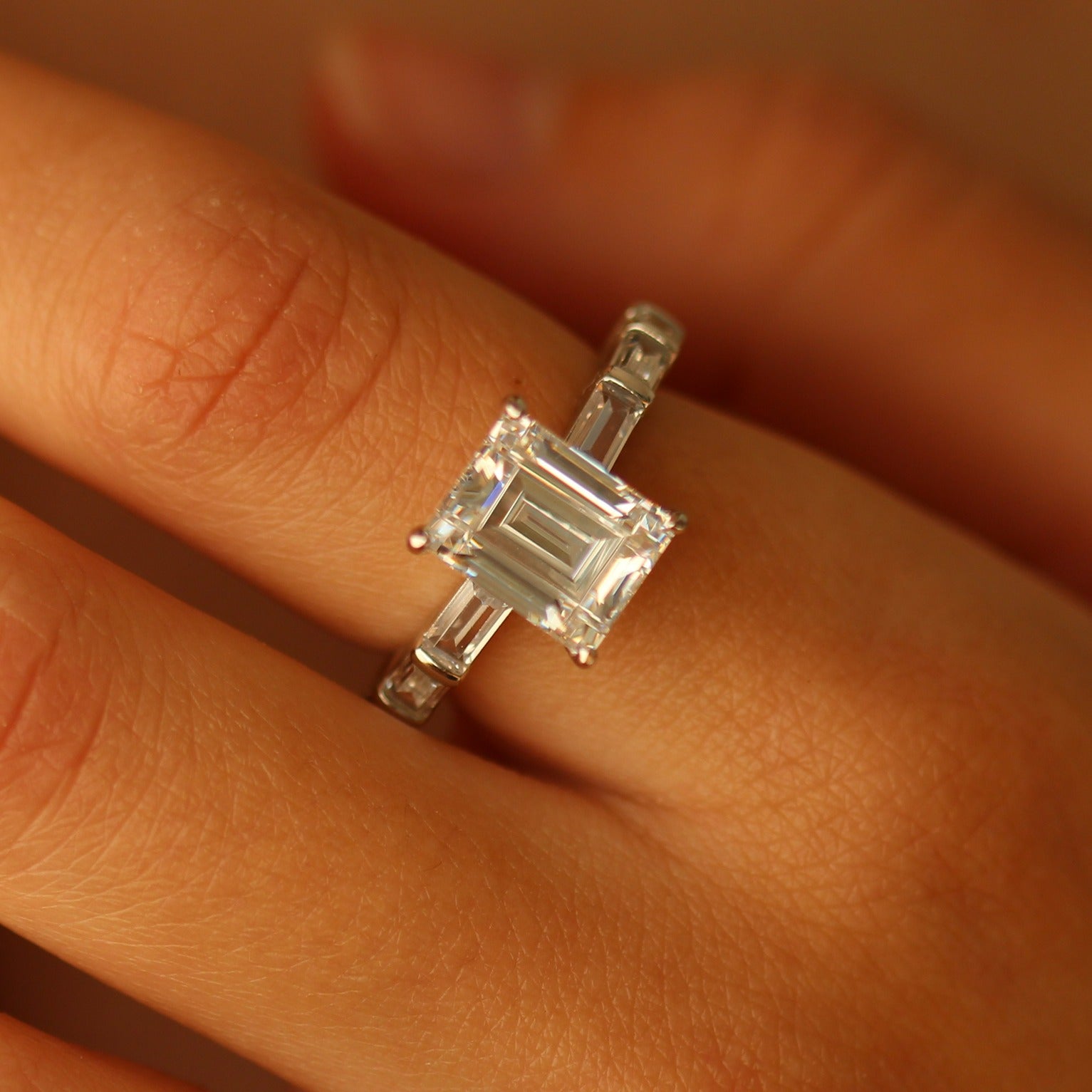 Miami emerald cut ring on hand
