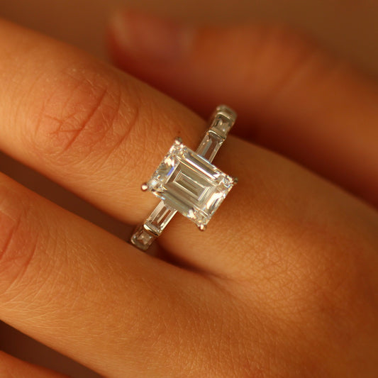 Miami emerald cut ring on hand