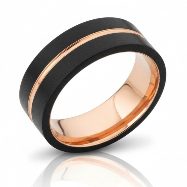 Rose gold and black mens ring on white background