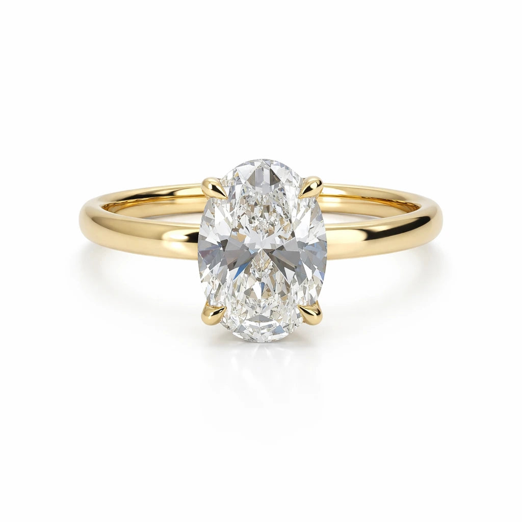 18k Gold oval lab grown diamond engagement ring on white background