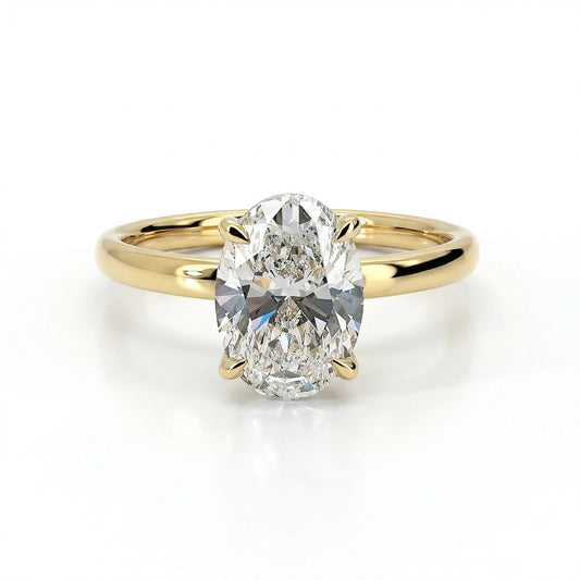 Gold oval lab grown diamond engagement ring on white background