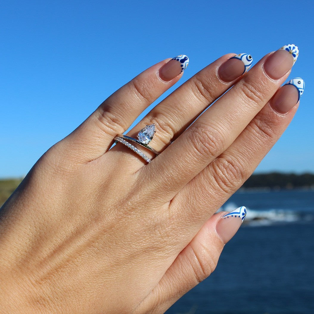 Pear silver ring on hand at La Perouse Beach, Sydney