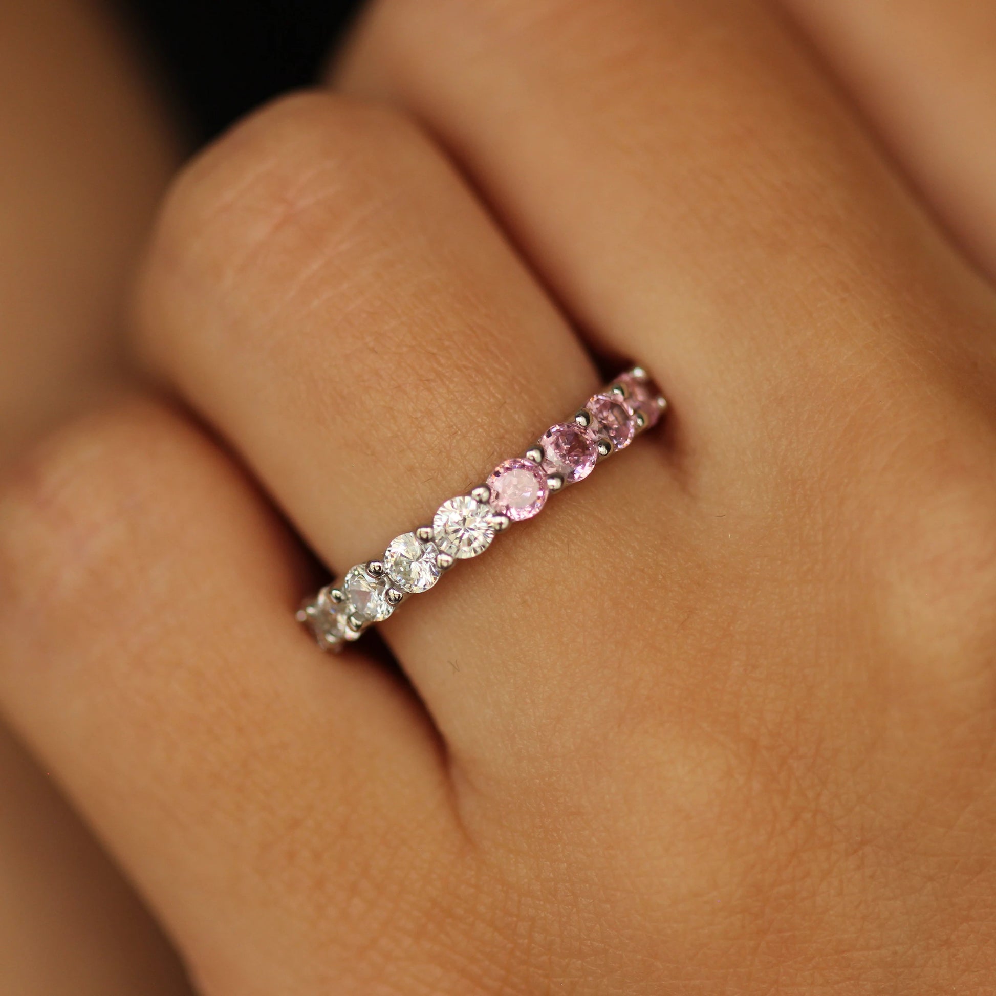 Pink eternity ring on hand