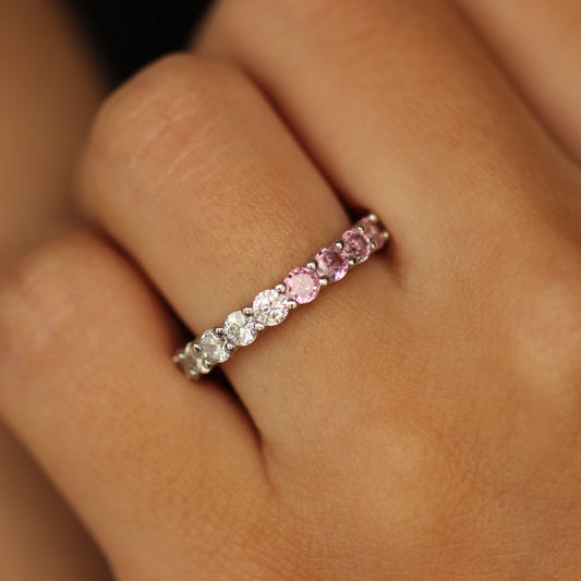 Pink eternity ring on hand