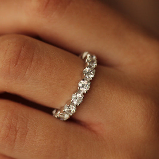 Round cut silver stacker ring on hand