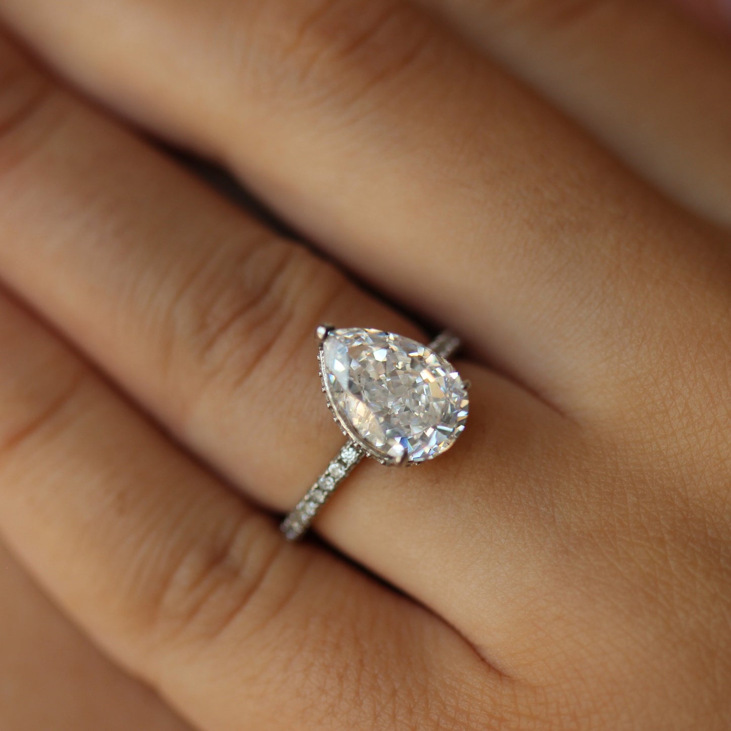 Silver 3 carat pear ring on hand