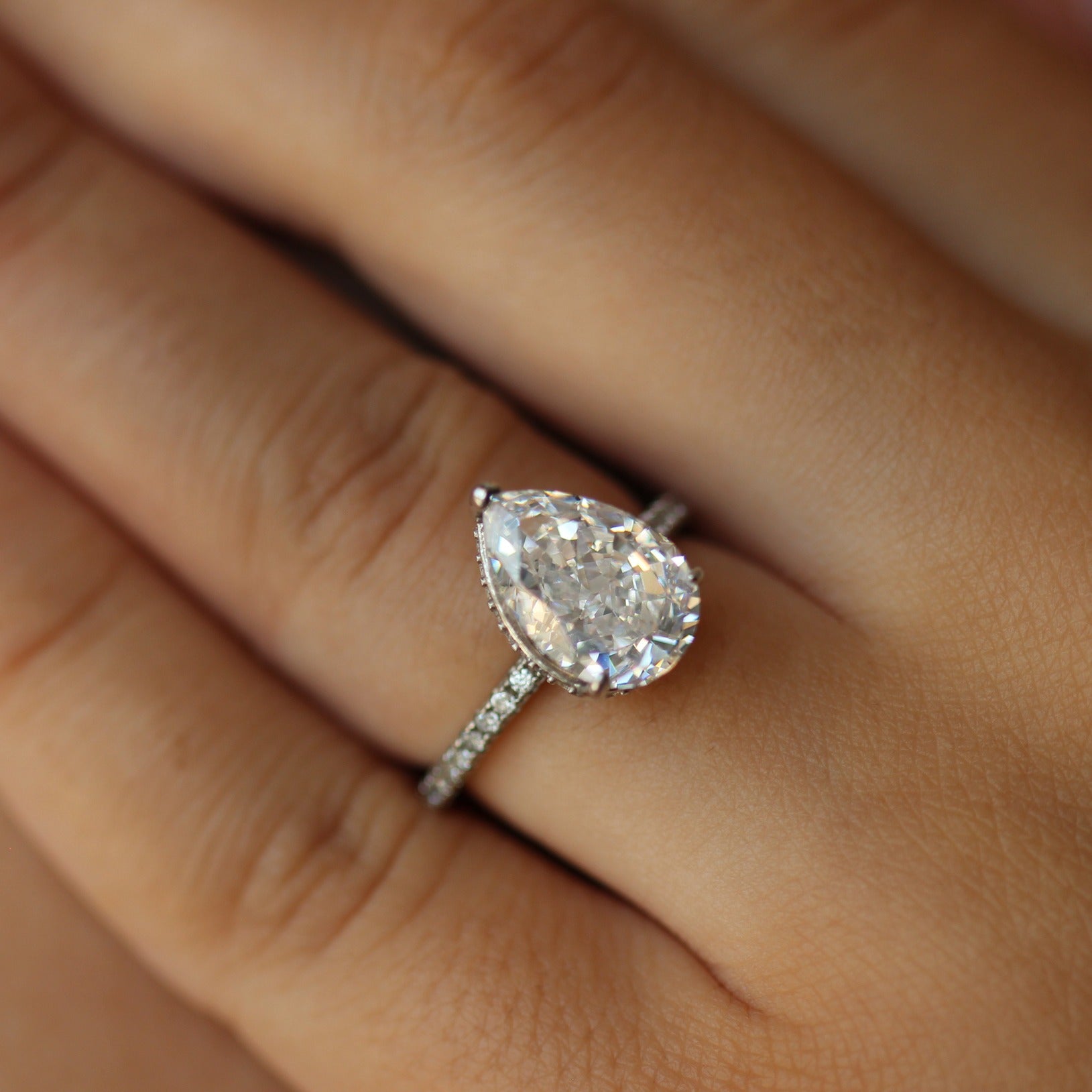 Silver 3 carat pear ring on hand