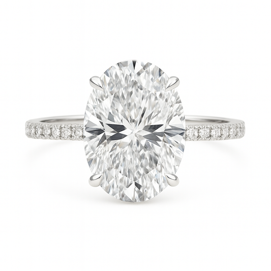 moissanite oval ring with a large central gemstone and smaller moissanite stones on the band against a white background