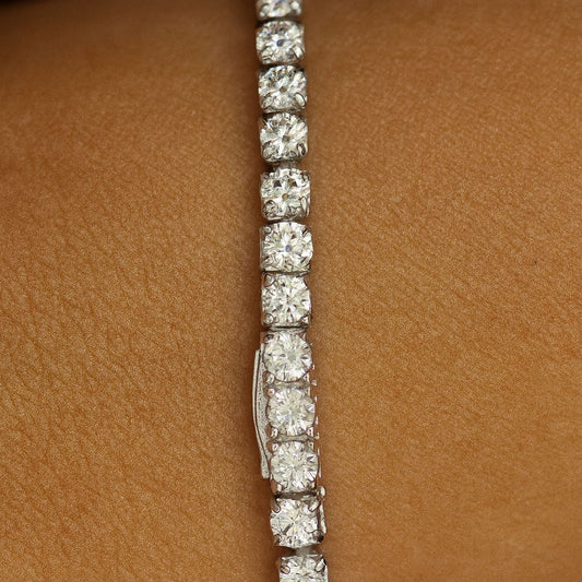 3mm silver tennis bracelet on wrist, up close shot of clasp