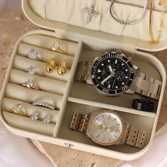 Travel jewellery case with cubic zirconia jewellery inside, Tissot watch and Vivienne Westwood watch
