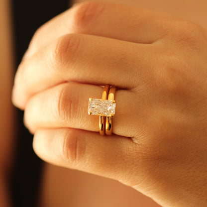emerald cut 18k gold vermeil ring on hand with gold vermeil wedding band