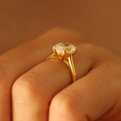 Side view of oval gold vermeil ring on hand