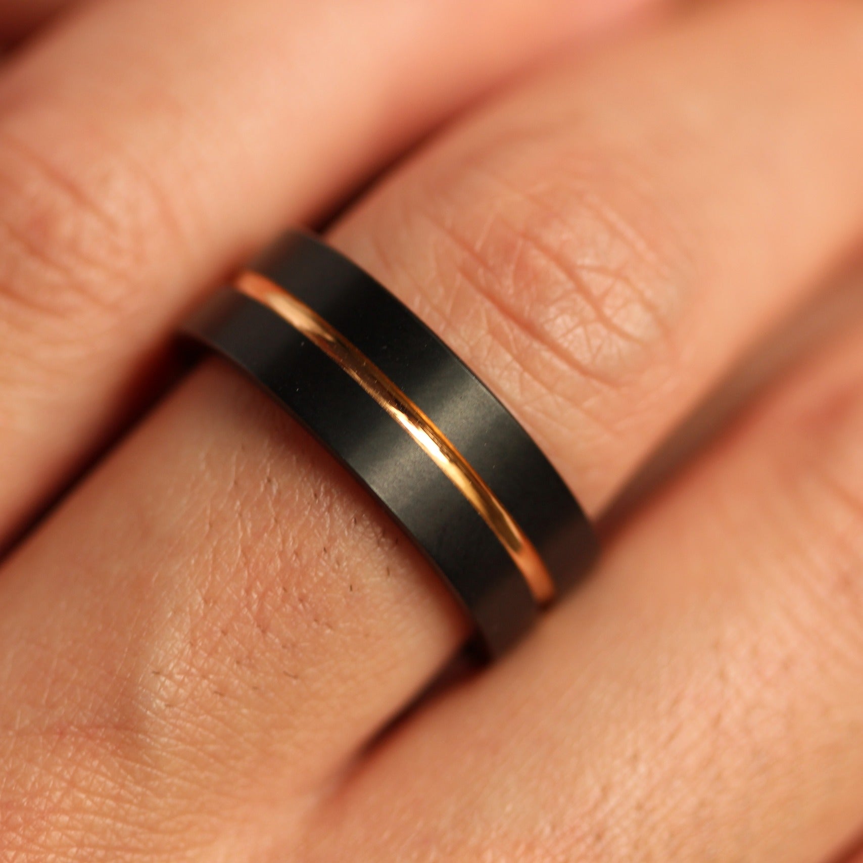8mm black tungsten men's wedding band with rose gold centre