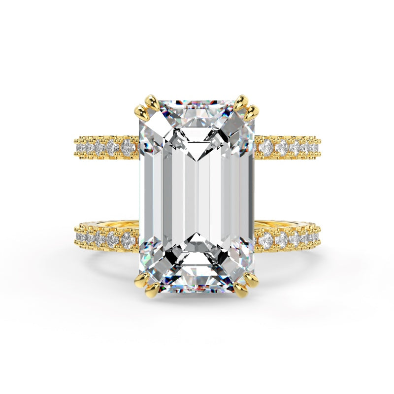 Gold emerald ring with two pave bands