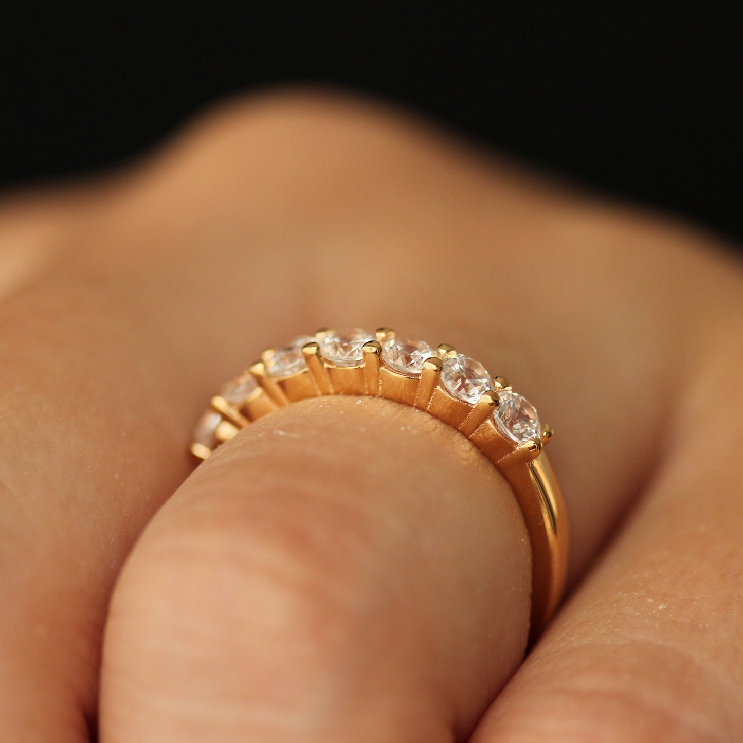 side profile view of champagne gold half eternity band