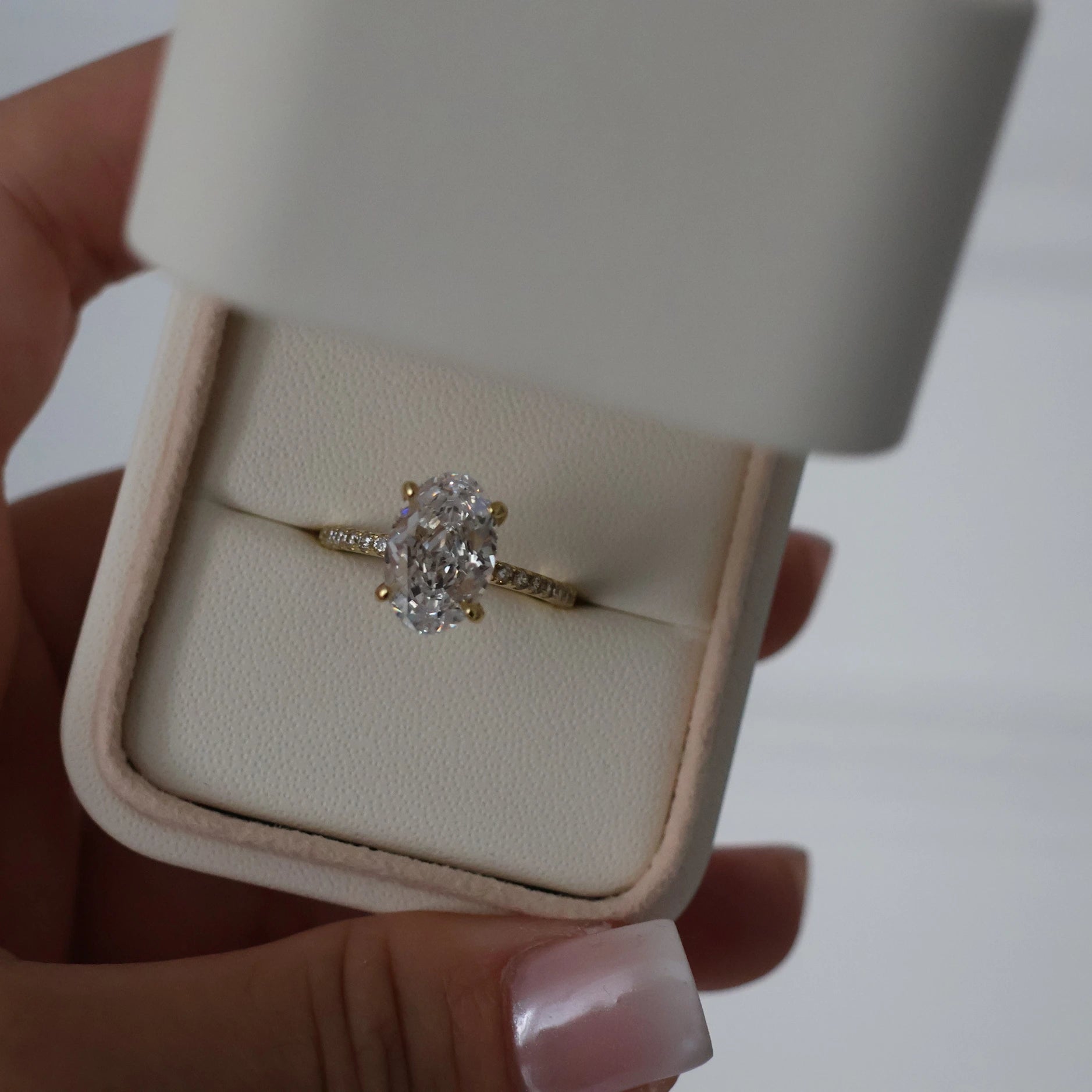 14k gold crushed ice oval engagement ring with pavé band
