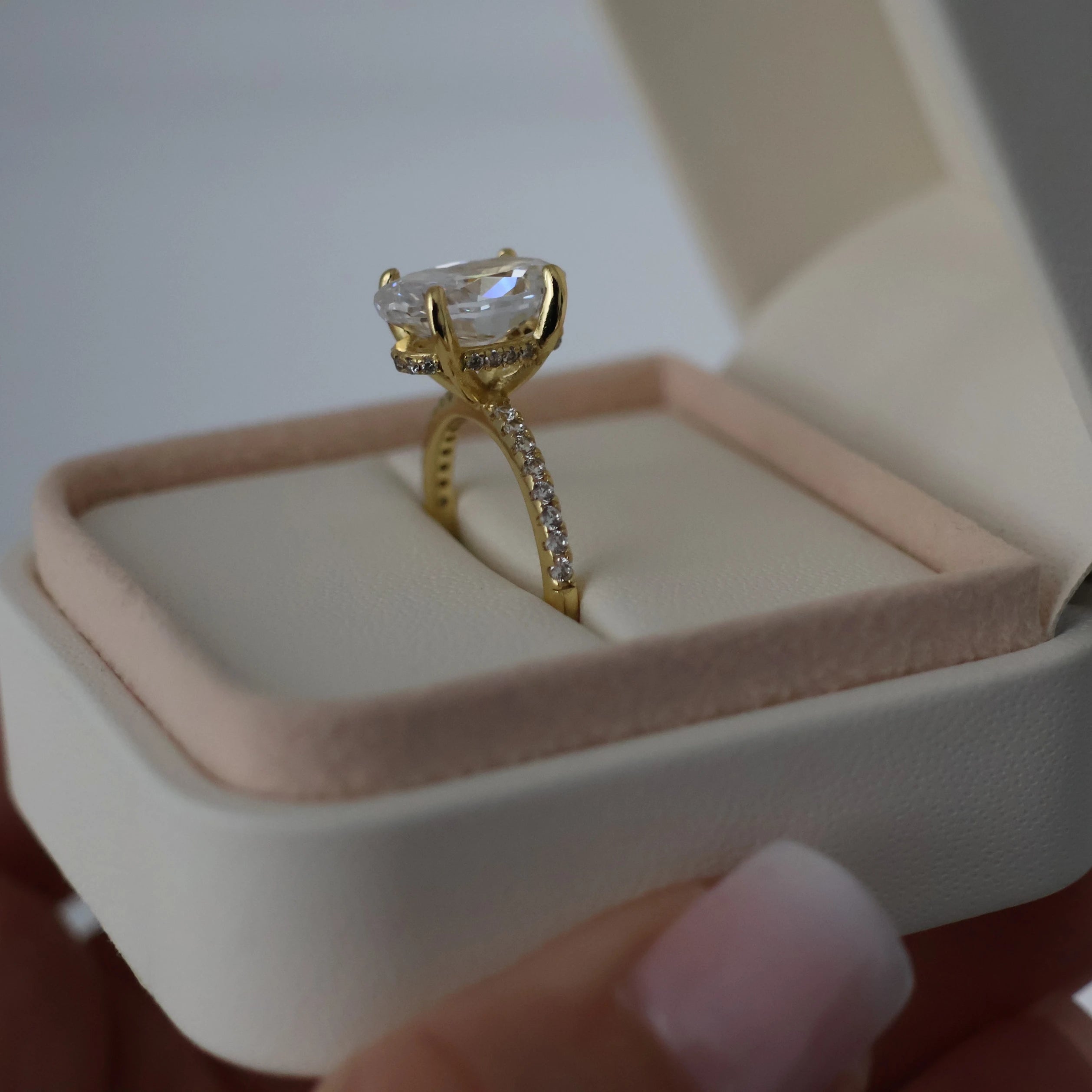 14k gold crushed ice oval engagement ring in proposal box