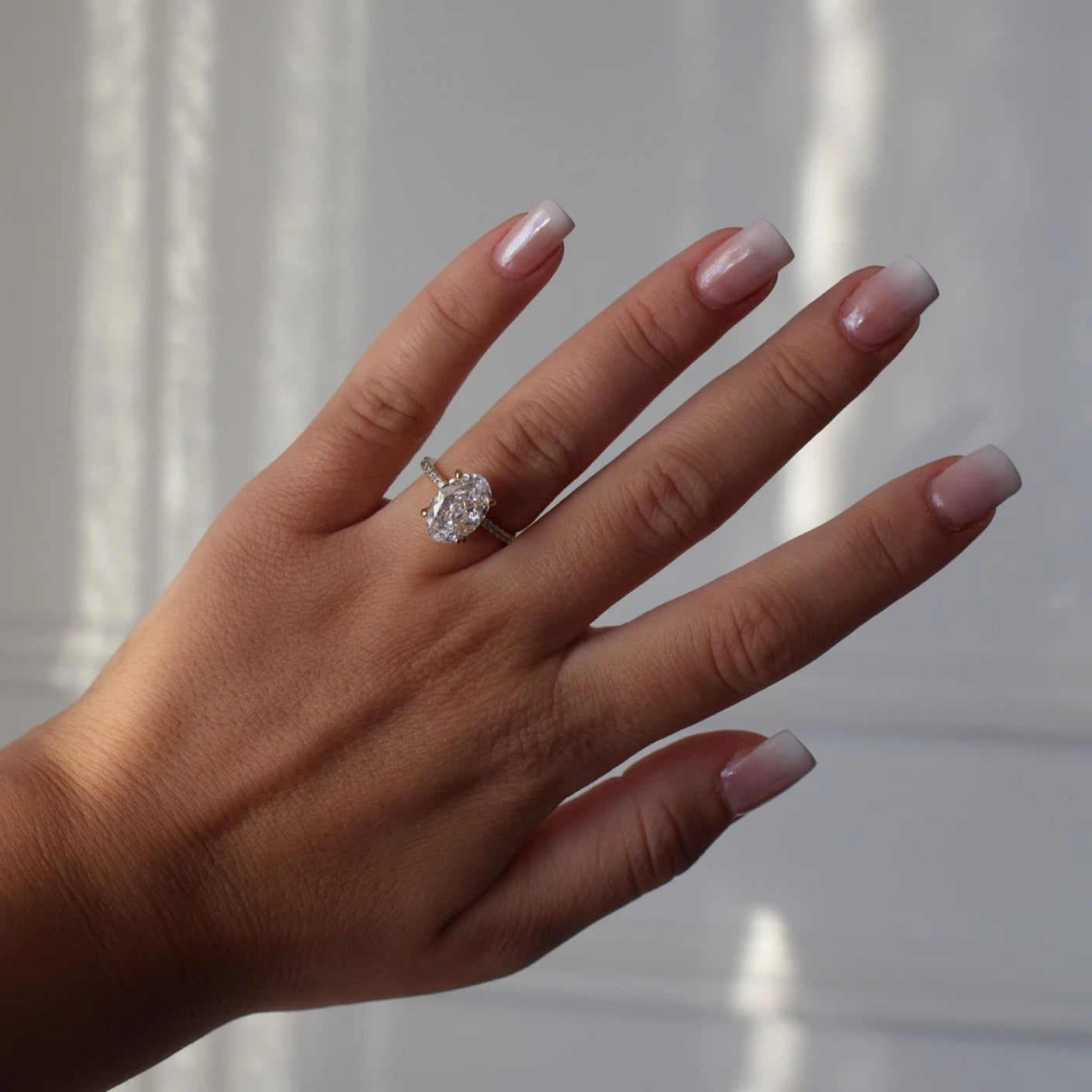 3.5 carat crushed ice oval ring in 14k gold with pavé band