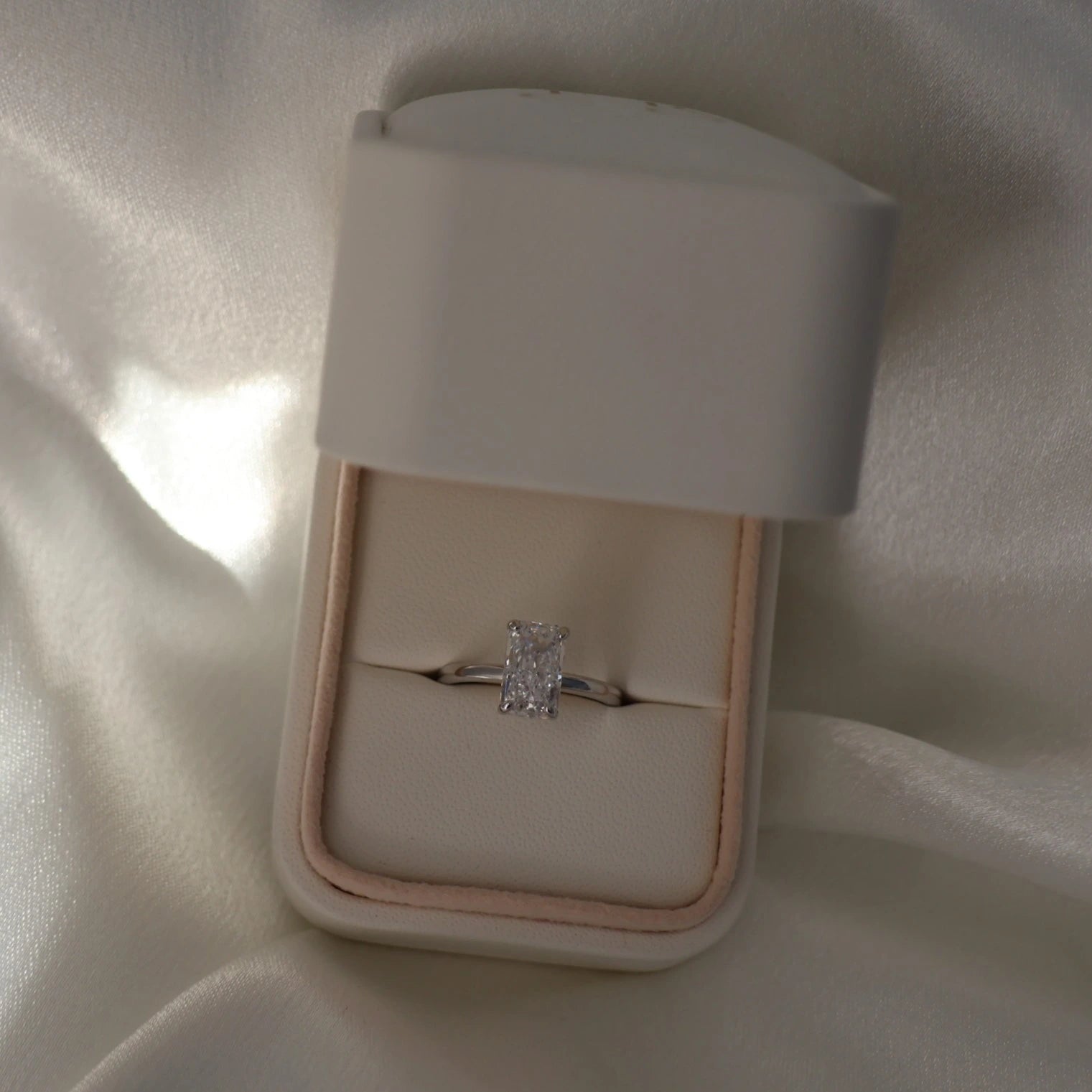 3 carat elongated radiant cut CZ silver solitaire ring in proposal box