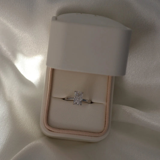 3 carat elongated radiant cut CZ silver solitaire ring in proposal box