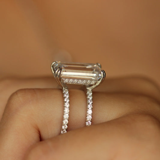 double row emerald ring with emerald cubic zirconia stone in silver on hand