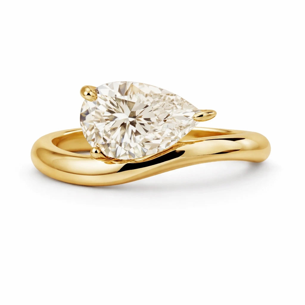 2.5 carat east west curved pear ring in 18k gold