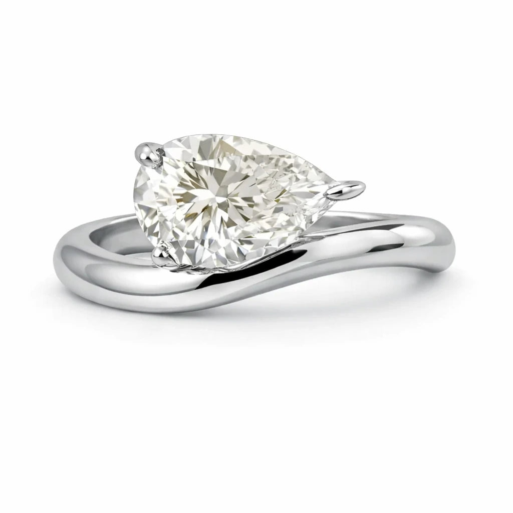 east west curved pear engagement ring in silver