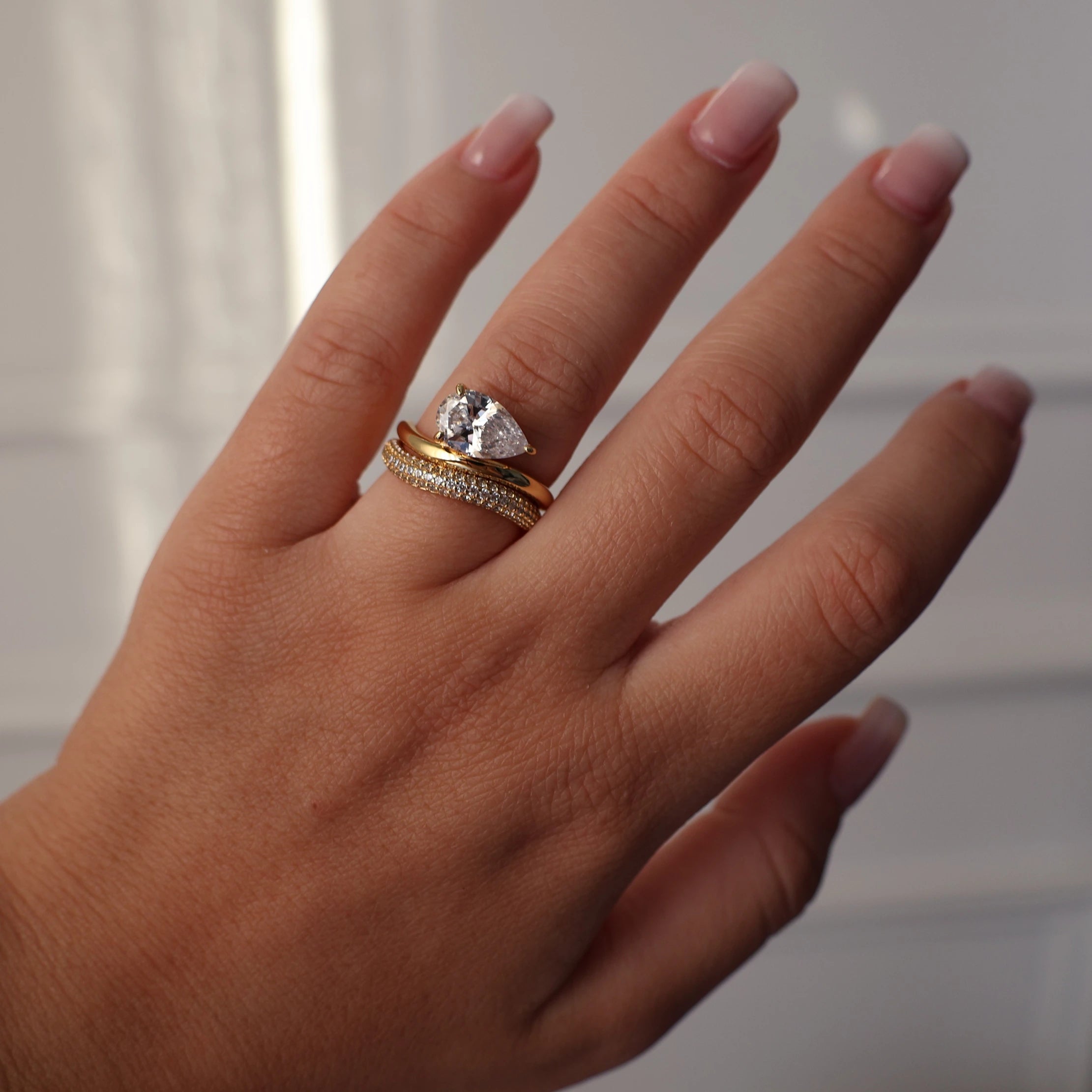 East west pear wedding ring set in gold