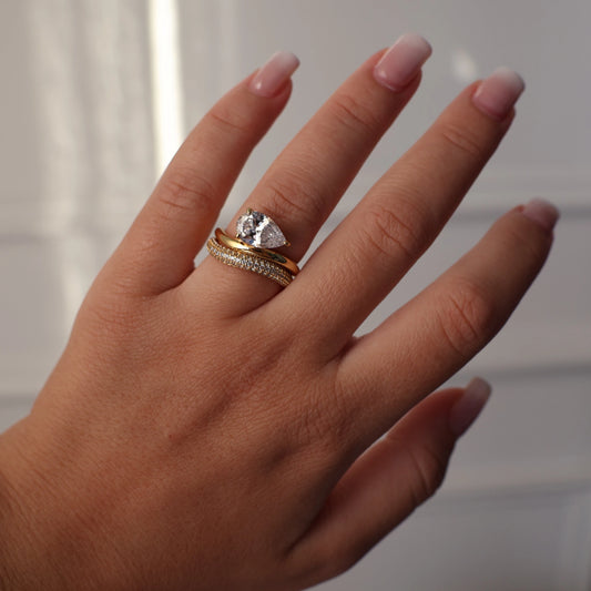 East west pear wedding ring set in gold