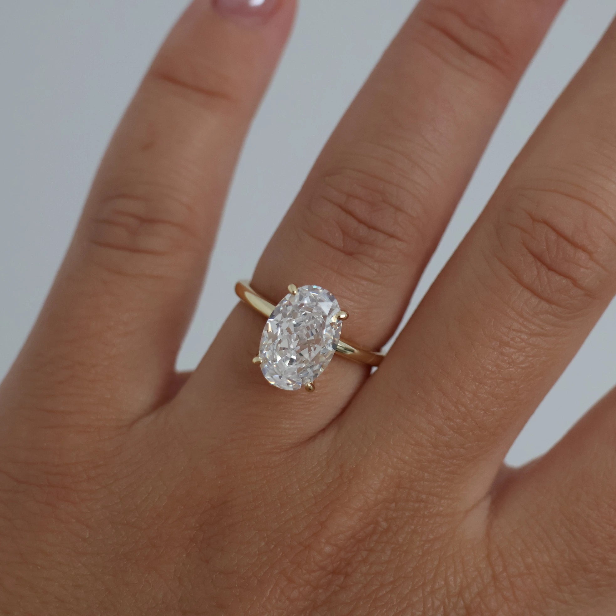 14k gold oval ring on hand