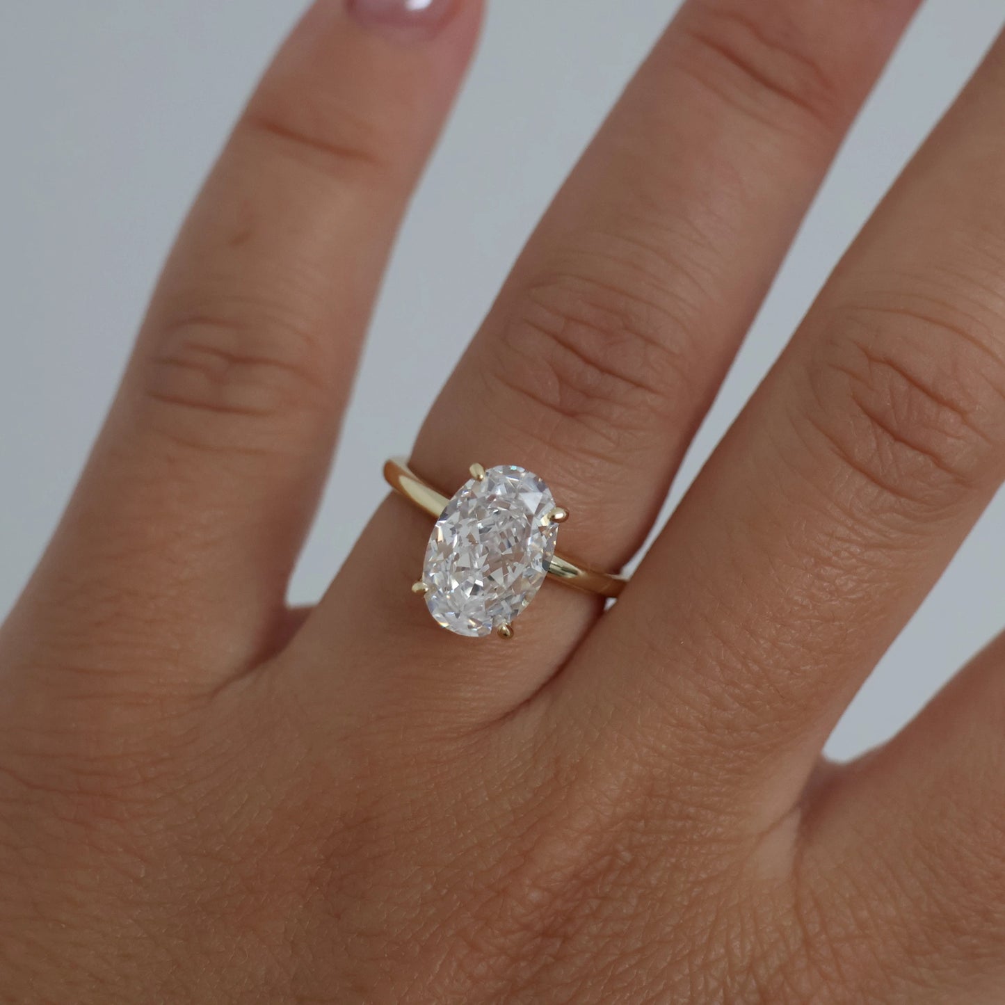14k gold oval ring on hand