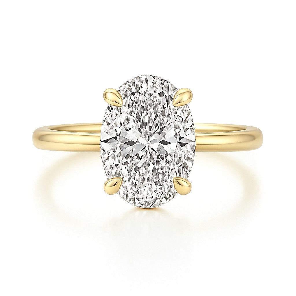 14k gold oval ring on white background