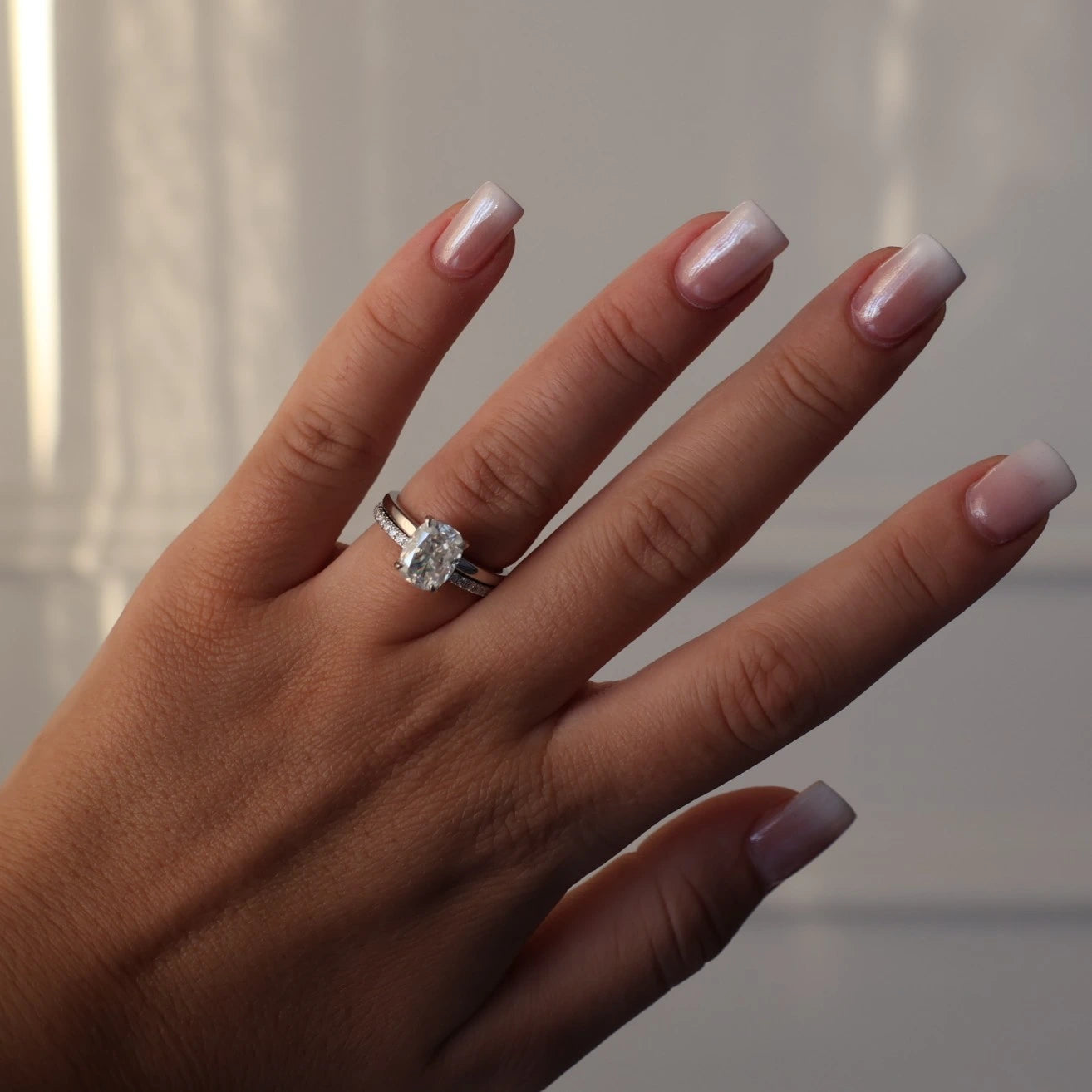 Elongated cushion 3ct moissanite ring in silver stacked with eternity band