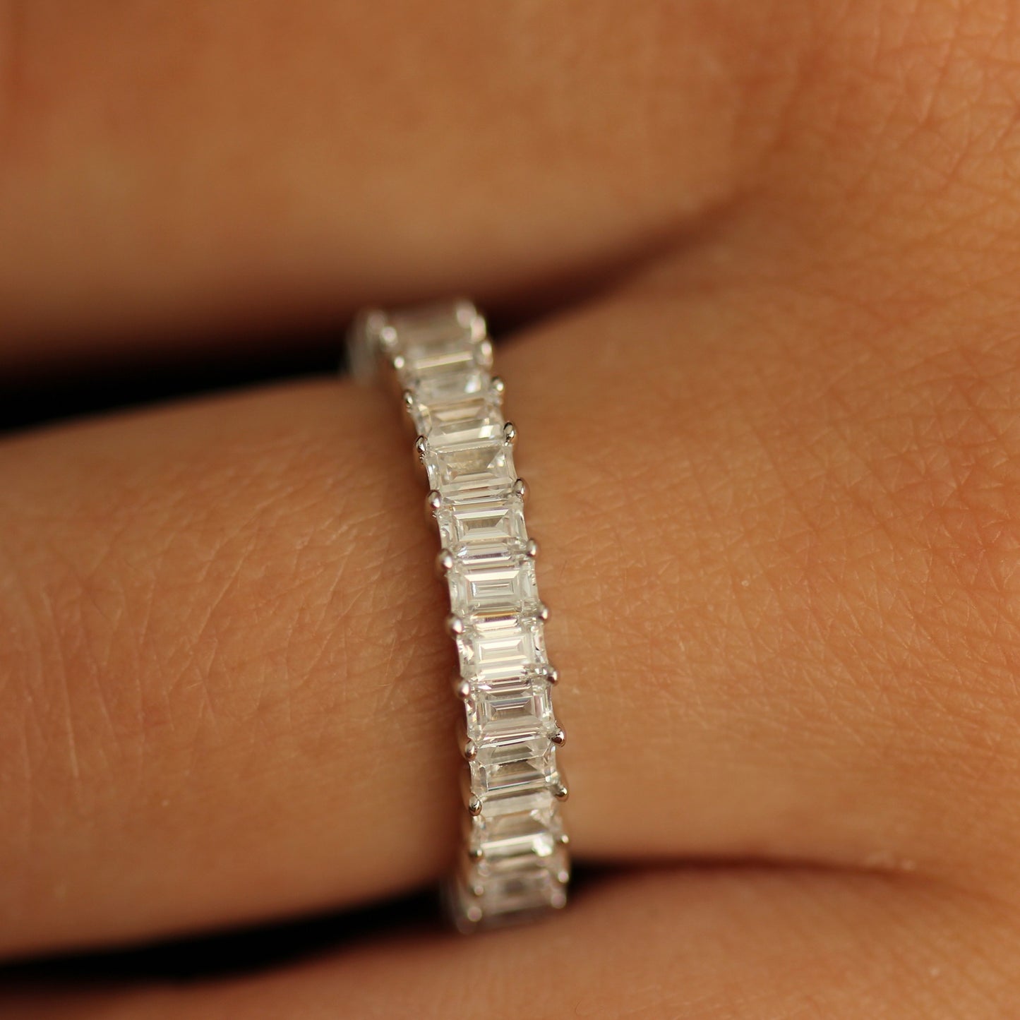 3mm cubic zirconia silver emerald eternity band on hand