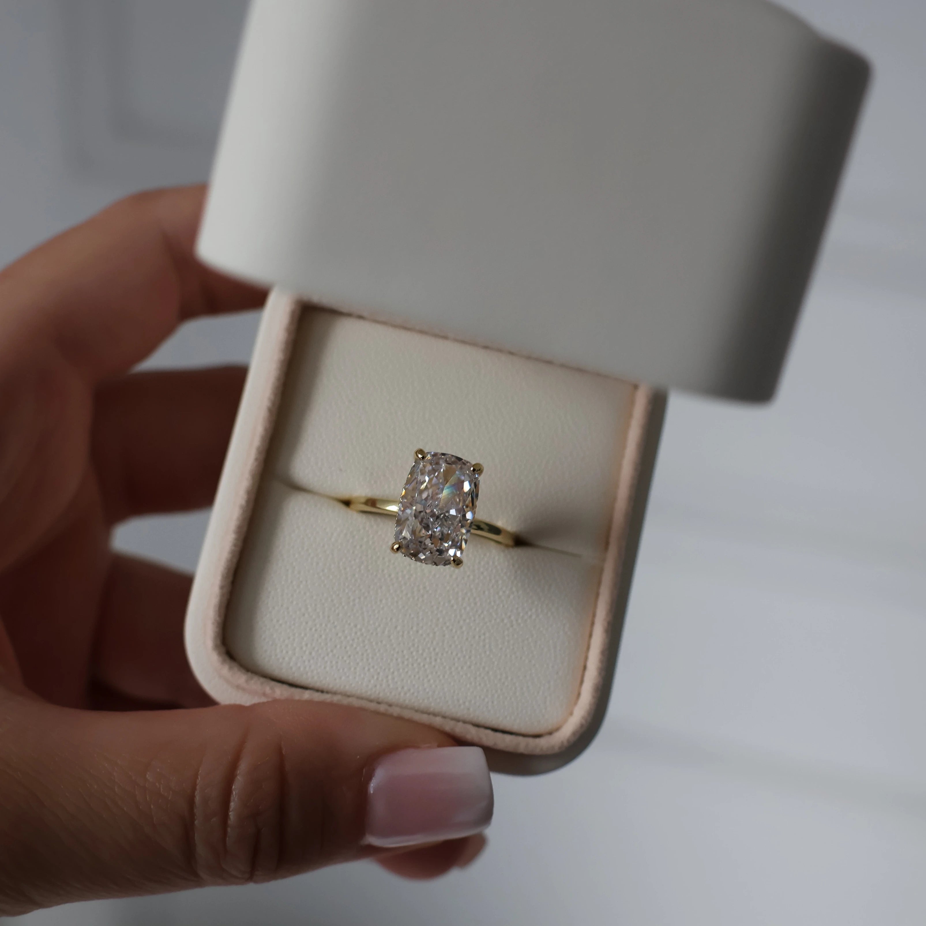 Gold ring with 3.5ct elongated cushion cut cubic zirconia